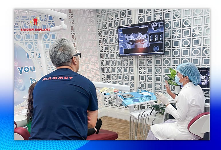 A patient reviewing a written treatment plan with a dentist at a dental clinic in Ho Chi Minh City.